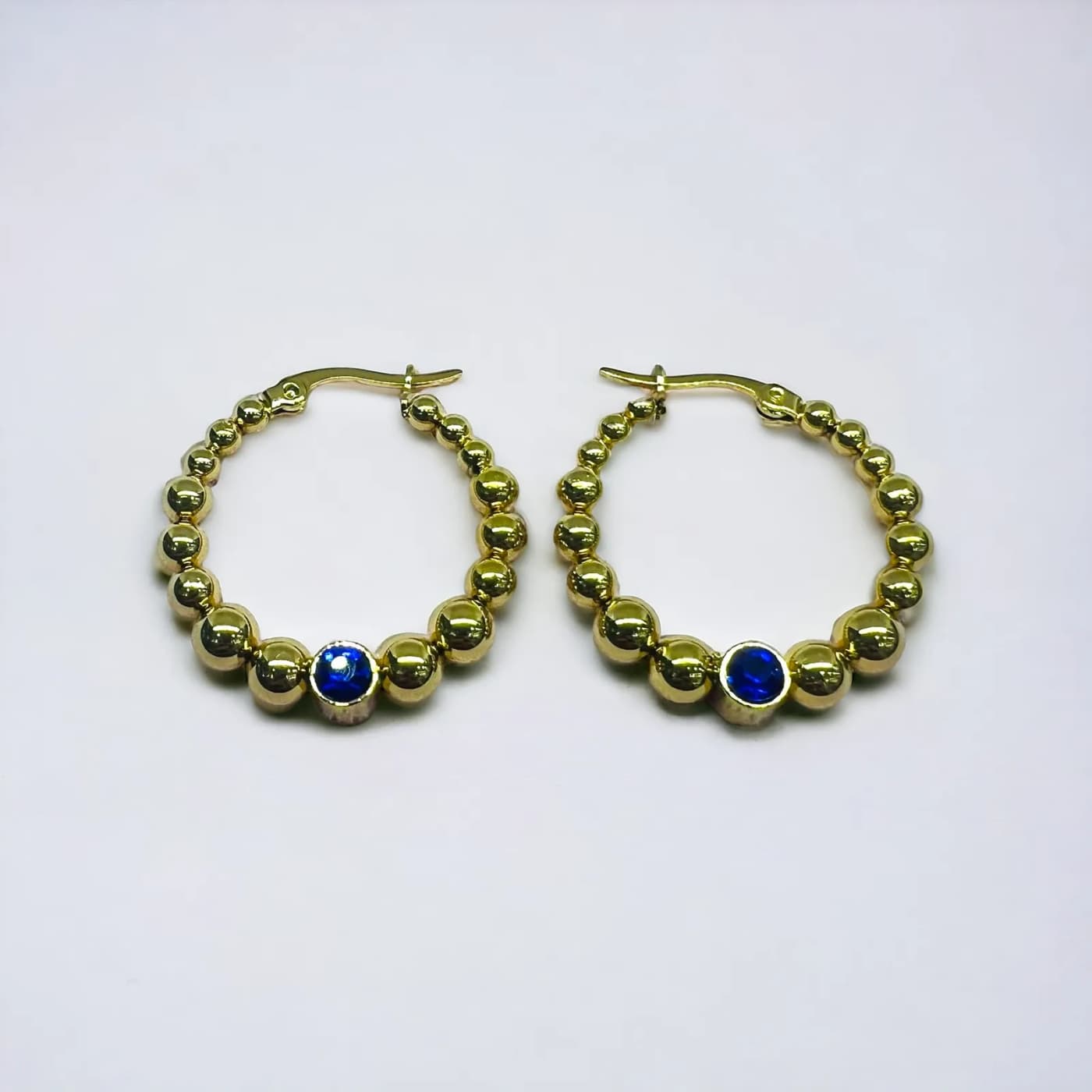 Aritos dorado con joya azul (30mm)