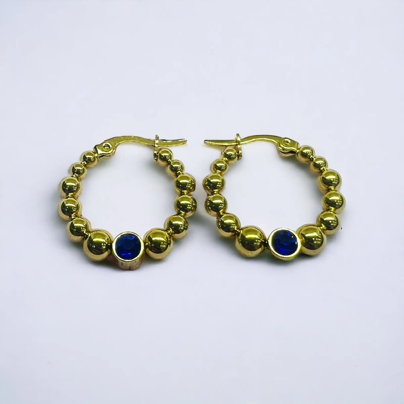 Aritos dorado con joya azul (25mm)