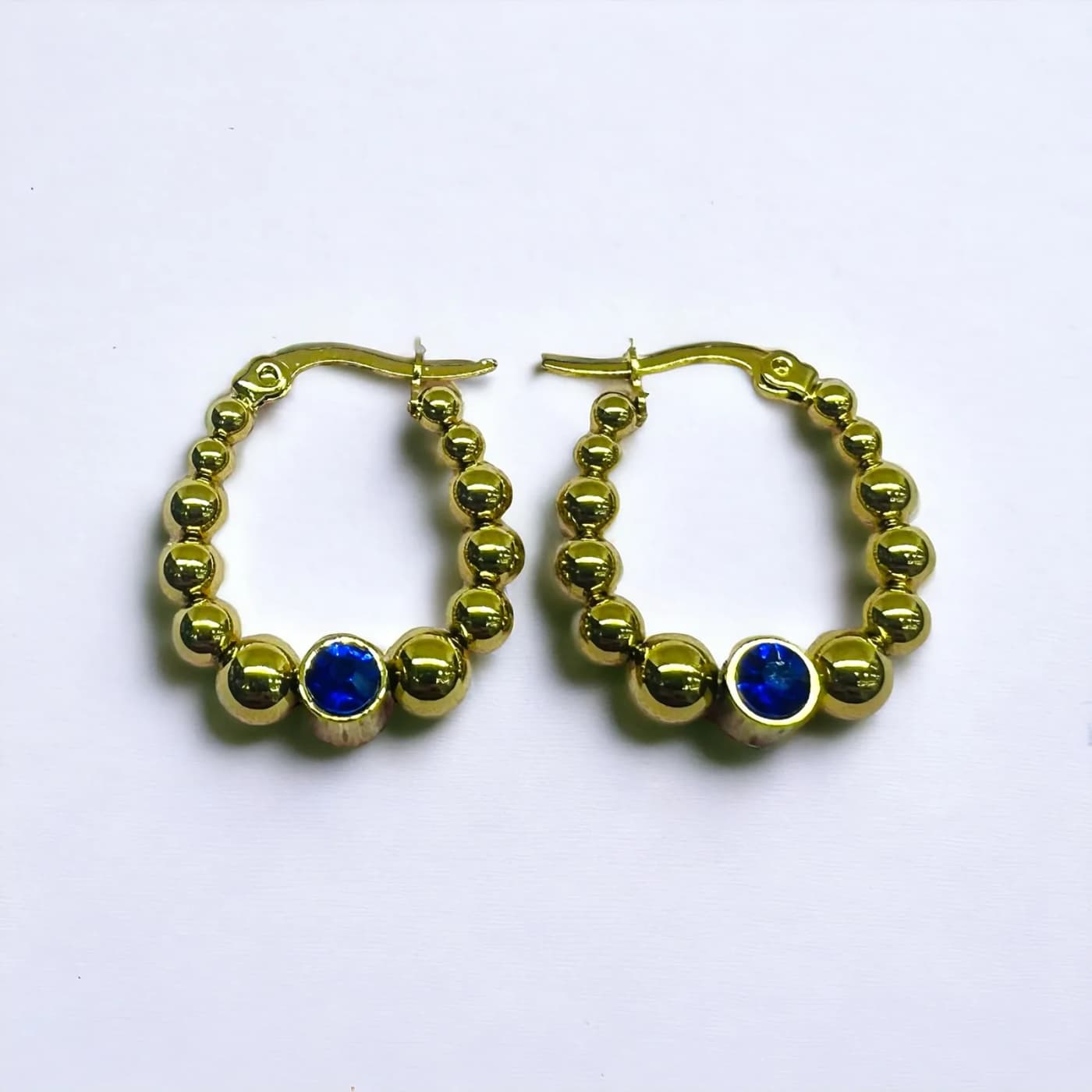 Aritos dorado con joya azul (25mm)