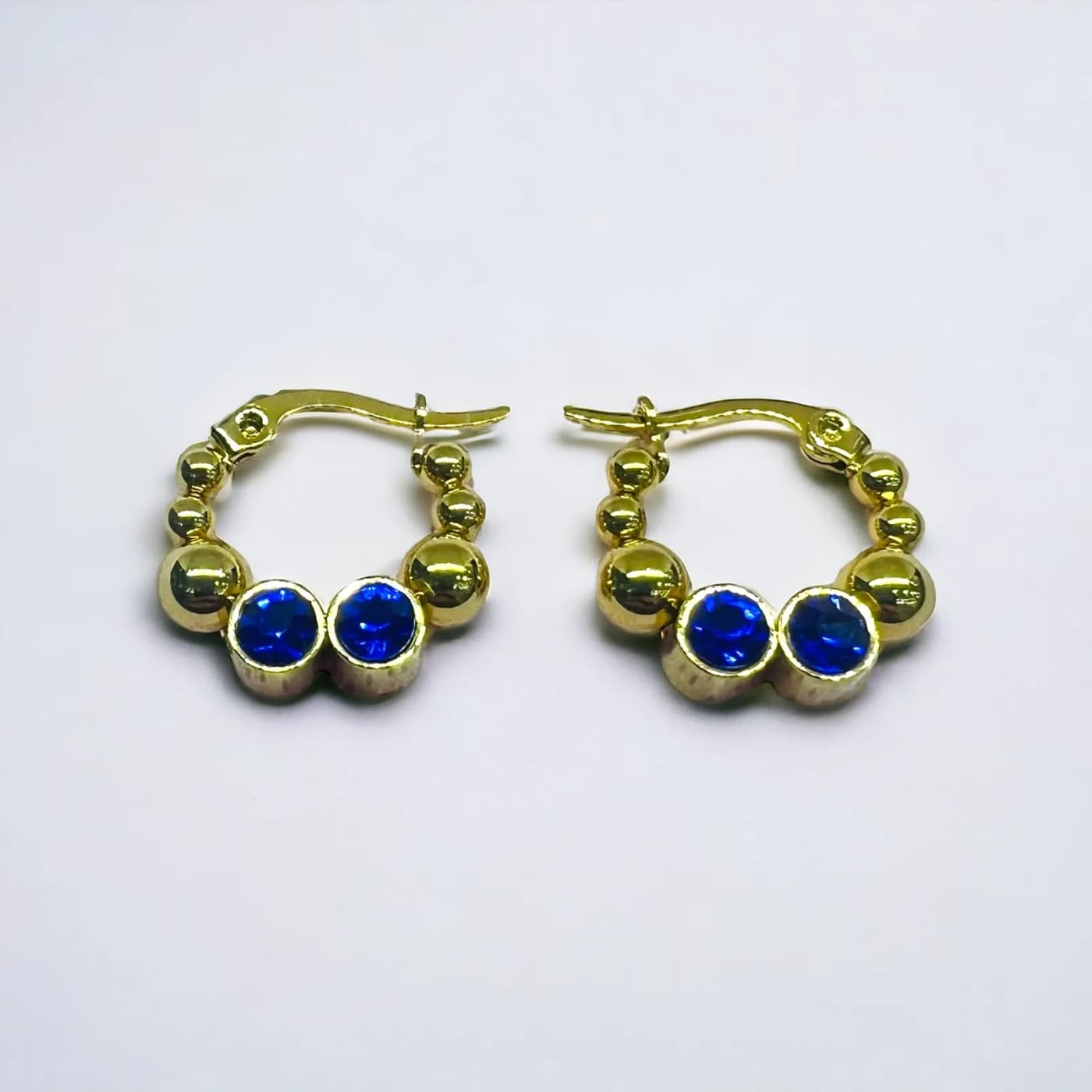 Aritos dorado con joya azul (250mm)
